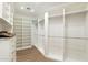 This walk-in closet has custom built-in storage on the walls at 9820 E Thompson Peak Pkwy # 629, Scottsdale, AZ 85255