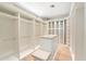 Spacious walk-in closet with custom shelving, ample storage, and a central island at 9820 E Thompson Peak Pkwy # 629, Scottsdale, AZ 85255