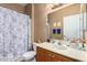 Bathroom featuring a toilet, vanity, and shower with floral shower curtain at 10136 E Southern Ave # 3065, Mesa, AZ 85209