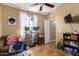 Inviting bedroom featuring a work space with a small couch and a large window for natural light at 10136 E Southern Ave # 3065, Mesa, AZ 85209