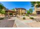 Well-manicured common area with a gazebo, picnic tables, barbecue grills, and manicured desert landscaping at 10136 E Southern Ave # 3065, Mesa, AZ 85209