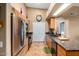 Well-lit kitchen with stainless steel appliances, dark countertops, and tile floors at 10136 E Southern Ave # 3065, Mesa, AZ 85209