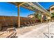 Community pool with lounge chairs under a shaded canopy, providing a relaxing outdoor space at 10136 E Southern Ave # 3065, Mesa, AZ 85209