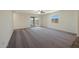 Main bedroom with a sliding glass door, neutral walls, carpet flooring and natural light at 1071 W West Virginia Ave, Florence, AZ 85132