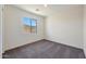 A bright bedroom with a neutral color palette and a large window at 1090 W West Virginia Ave, Florence, AZ 85132