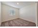 Bright bedroom featuring a large window and neutral color palette at 1090 W West Virginia Ave, Florence, AZ 85132