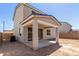 Backyard showcases a covered patio with stylish pillars and outdoor living space at 11627 W Beck Ave, Youngtown, AZ 85363