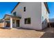The backyard has a covered patio and minimal landscaping at 11627 W Beck Ave, Youngtown, AZ 85363