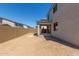 An expansive backyard with a covered patio, ideal for enjoying outdoor activities and relaxation at 11627 W Beck Ave, Youngtown, AZ 85363