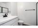 Modern bathroom with black hardware at 11627 W Beck Ave, Youngtown, AZ 85363