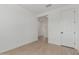 Clean bedroom features white walls, light-colored floors, and a crisp white door at 11627 W Beck Ave, Youngtown, AZ 85363