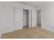 Spacious bedroom with carpet, closet and entry to other rooms offering ample storage at 11627 W Beck Ave, Youngtown, AZ 85363