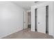 Bedroom with open closet and view to hallway at 11627 W Beck Ave, Youngtown, AZ 85363