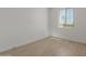 Bright bedroom with light-colored floors and a window offering natural light at 11627 W Beck Ave, Youngtown, AZ 85363