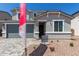 Charming two-story home featuring a gray stucco facade, a two-car garage, and a welcoming entryway at 11627 W Beck Ave, Youngtown, AZ 85363