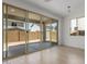 Covered patio view through sliding glass doors with natural light and outdoor living at 11627 W Beck Ave, Youngtown, AZ 85363