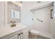 Bright bathroom featuring modern fixtures, a vanity, and a walk-in shower at 12021 N Riviera Ct, Sun City, AZ 85351