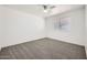 Bright bedroom with carpet and a large window at 12021 N Riviera Ct, Sun City, AZ 85351