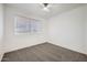 Bright bedroom with carpet and a large window at 12021 N Riviera Ct, Sun City, AZ 85351