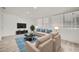 Comfortable living room with modern furnishings, including a plush sofa and stylish decor at 12021 N Riviera Ct, Sun City, AZ 85351