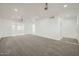 Spacious living room with fresh paint, soft carpet, recessed lighting, and neutral colors at 12021 N Riviera Ct, Sun City, AZ 85351