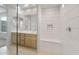 Stylish bathroom featuring a double vanity, a bright shower, and modern fixtures at 13548 W Copperleaf Ln, Peoria, AZ 85383