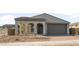 Charming single-story home featuring a stylish arched entryway and a convenient two-car garage at 13548 W Copperleaf Ln, Peoria, AZ 85383