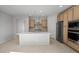 Bright and airy kitchen with a large island, stainless steel appliances, and neutral tones at 13548 W Copperleaf Ln, Peoria, AZ 85383