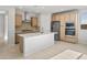 Spacious kitchen features a large island, stainless steel appliances, and abundant cabinet space at 13548 W Copperleaf Ln, Peoria, AZ 85383