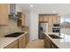 Modern kitchen featuring stainless steel appliances, ample cabinetry, and a center island at 13548 W Copperleaf Ln, Peoria, AZ 85383