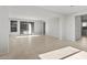 Expansive living room with tile flooring and abundant natural light, perfect for entertaining at 13548 W Copperleaf Ln, Peoria, AZ 85383