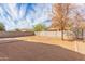 Expansive dirt backyard featuring desert landscaping and block fencing, offering privacy and potential for customization at 1380 W Angus Rd, San Tan Valley, AZ 85143