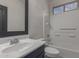 Bathroom featuring a toilet, shower-tub combination, and blue vanity with ample counter space at 1380 W Angus Rd, San Tan Valley, AZ 85143