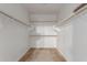 Walk-in closet providing ample storage with multiple rods for organized clothing and accessories at 1380 W Angus Rd, San Tan Valley, AZ 85143
