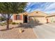 Charming single-story home with a well-maintained yard, desert landscaping, and red shutters at 1380 W Angus Rd, San Tan Valley, AZ 85143