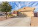 Inviting single-Gathering home featuring a two-car garage, desert landscaping, and a covered entrance at 1380 W Angus Rd, San Tan Valley, AZ 85143
