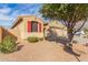 Charming single-story home with red shutters, a desert-landscaped yard, and an attached two-car garage at 1380 W Angus Rd, San Tan Valley, AZ 85143