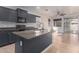 Modern kitchen featuring an island, granite counters, stainless steel appliances, and an open layout at 1380 W Angus Rd, San Tan Valley, AZ 85143