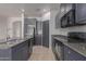 Well-equipped kitchen showcasing granite countertops and modern stainless steel appliances at 1380 W Angus Rd, San Tan Valley, AZ 85143