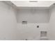 Laundry room offers connections and space for washer and dryer, simplifying laundry tasks at 1380 W Angus Rd, San Tan Valley, AZ 85143