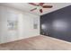 Cozy bedroom with carpet, ceiling fan, and two windows at 1380 W Angus Rd, San Tan Valley, AZ 85143