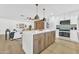 Spacious island kitchen featuring modern appliances and a seamless connection to the living area at 1411 S Glenview --, Mesa, AZ 85204