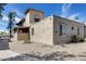 Beige stucco home featuring desert landscaping, brick accents and multiple stories under a bright, sunny sky at 14644 N Yerba Buena Way # C, Fountain Hills, AZ 85268