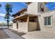 Beige stucco home featuring an enclosed, elevated patio with brick accents, and desert landscaping under a sunny sky at 14644 N Yerba Buena Way # C, Fountain Hills, AZ 85268