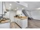 Bright kitchen with white cabinetry, granite countertops, and modern stainless steel appliances at 14644 N Yerba Buena Way # C, Fountain Hills, AZ 85268
