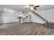 Bright living room with vinyl floors, open to the kitchen and staircase to the second floor at 14644 N Yerba Buena Way # C, Fountain Hills, AZ 85268