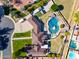 Grand estate showcasing a resort-style pool and spa, a pristine lawn, and a luxurious brick home at 1520 E Elmwood Cir, Mesa, AZ 85203