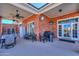 Inviting back patio area with a brick exterior, outdoor furniture, heater, and a barbecue at 1520 E Elmwood Cir, Mesa, AZ 85203