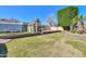 Spacious backyard featuring lush green grass and an outdoor playhouse at 1520 E Elmwood Cir, Mesa, AZ 85203