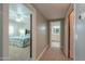 Hallway view with the main bedroom and en suite bathroom with great natural light at 1520 E Elmwood Cir, Mesa, AZ 85203